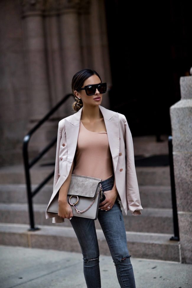 fashion blogger mia mia mine wearing a blush blazer from revolve and quay sunglasses