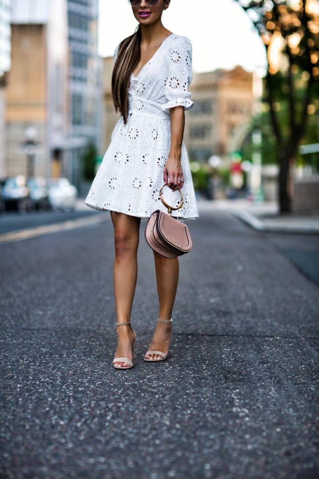 fashion blogger mia mia mine wearing sam edelman suede nude heels and an eyelet dress from revolve