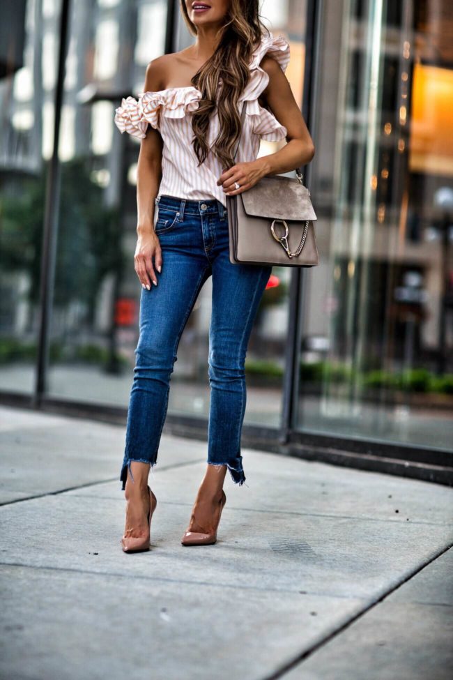 fashion blogger mia mia mine wearing a petersyn striped yellow top from revolve and christian louboutin so kate heels