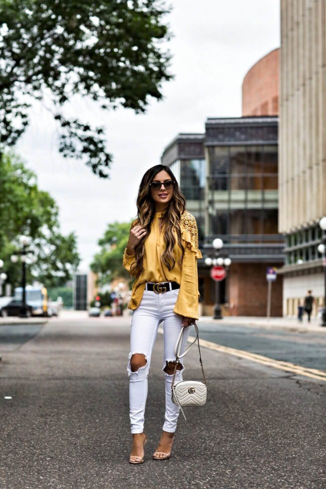 fashion blogger mia mia mine wearing a yellow free people top and gucci marmont bag 