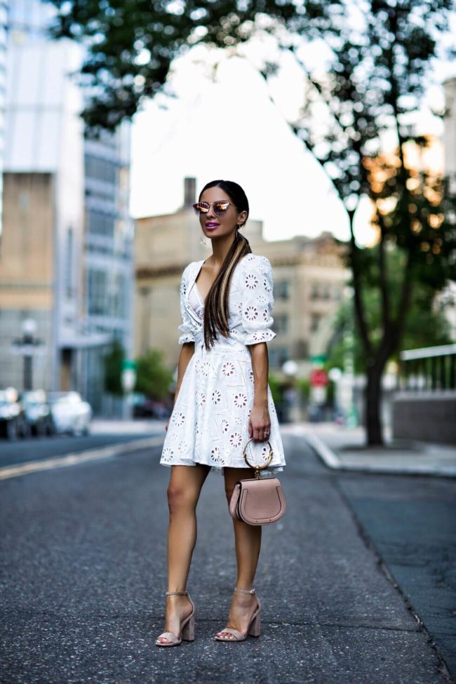 fashion blogger mia mia mine wearing an eyelet lovers + friends white lace dress from revolve