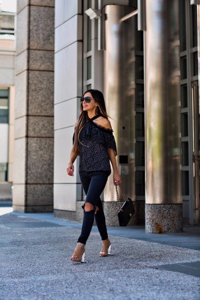 fashion blogger mia mia mine wearing free people ripped jeans and a cutout lace top from macy's