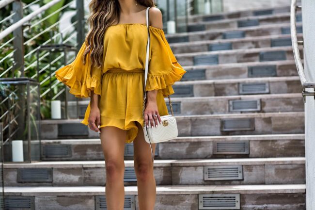 fashion blogger mia mia mine wearing an off-the-shoulder yellow romper and a gucci marmont mini bag from nordstrom