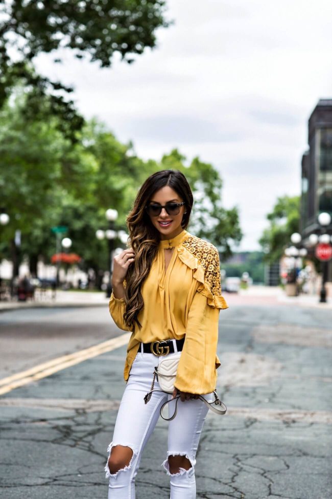 mn fashion blogger mia mia mine wearing a yellow free people top from macy's and white denim