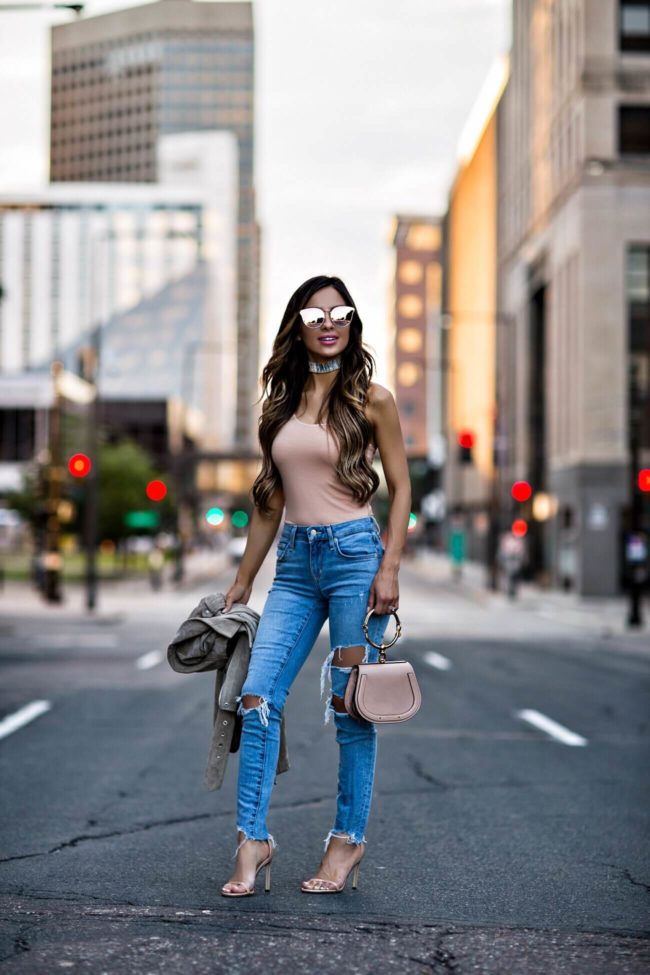 fashion blogger mia mia mine wearing a blush pink bodysuit with an antique rose colored chloe nile small bag