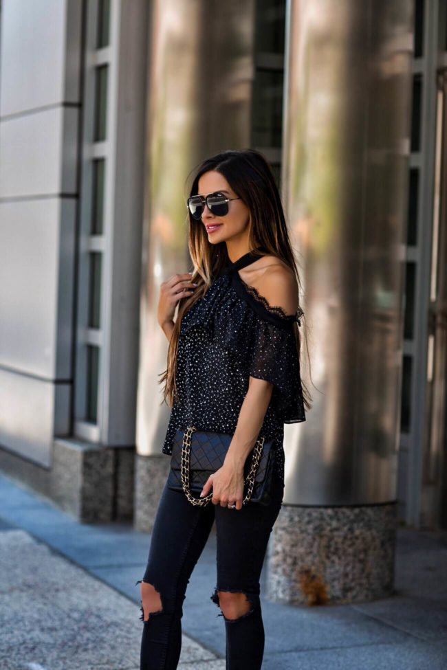 fashion blogger mia mia mine wearing a cutout top from macy's and lucite heels
