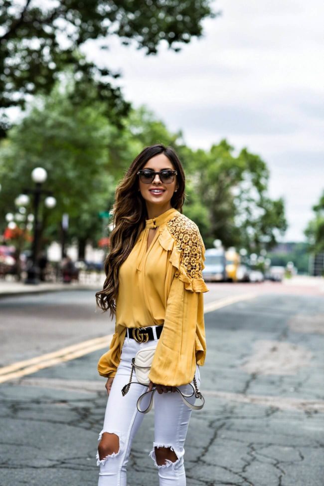 fashion blogger mia mia mine wearing a yellow free people top from macy's