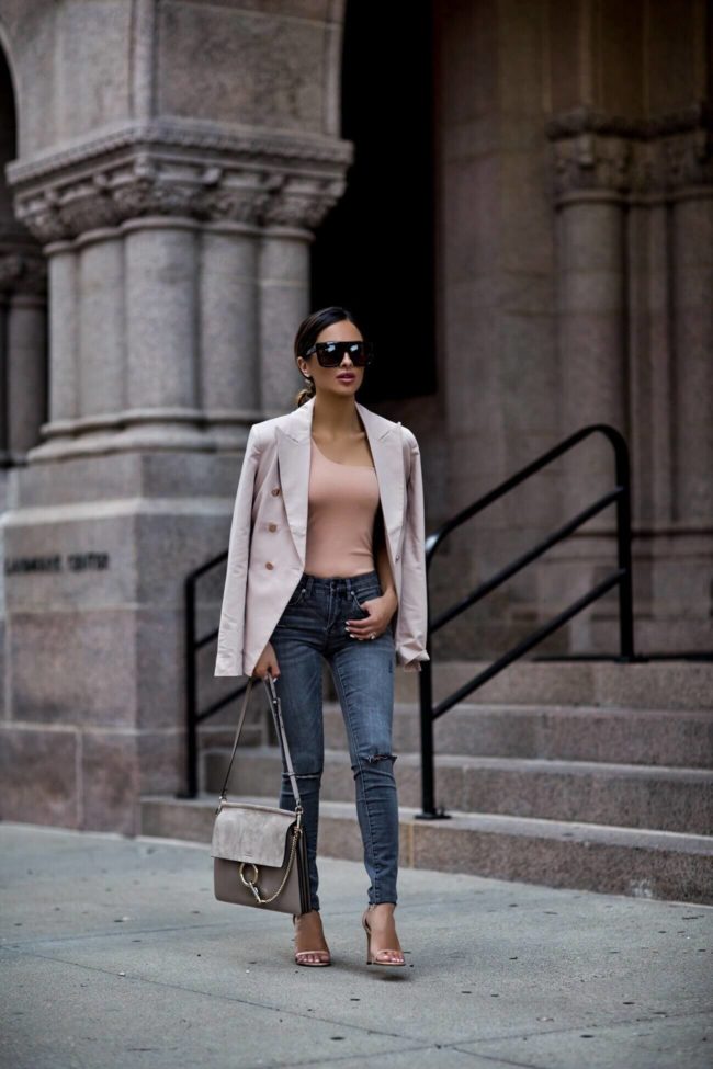 fashion blogger mia mia mine wearing a blush blazer from revolve and a chloe faye bag