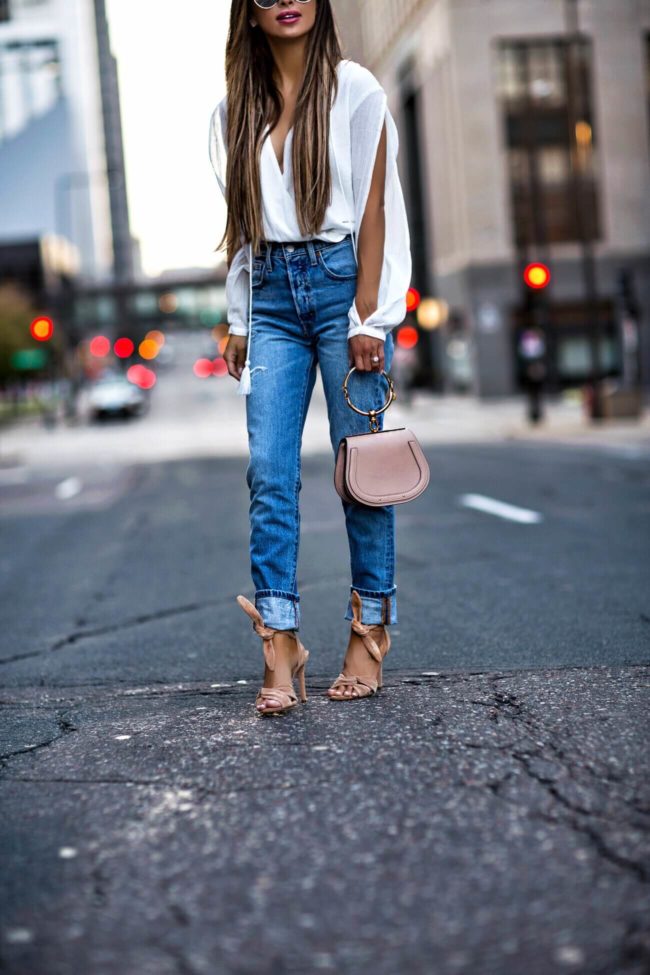 fashion blogger mia mia mine wearing levi's jeans from revolve and schutz tie heels