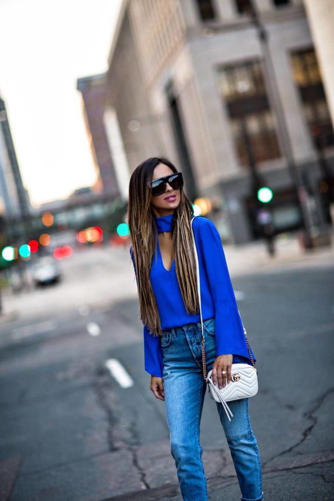 fashion blogger mia mia mine wearing a blue cutout top from revolve and a gucci marmont mini bag