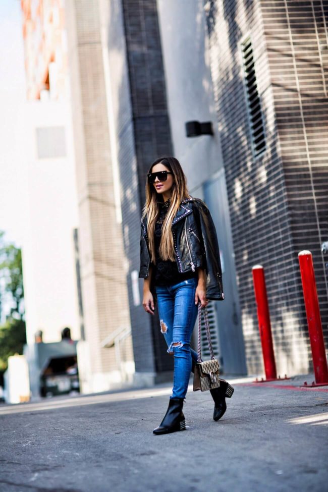 fashion blogger mia mia mine wearing a studded leather jacket from bloomingdale's