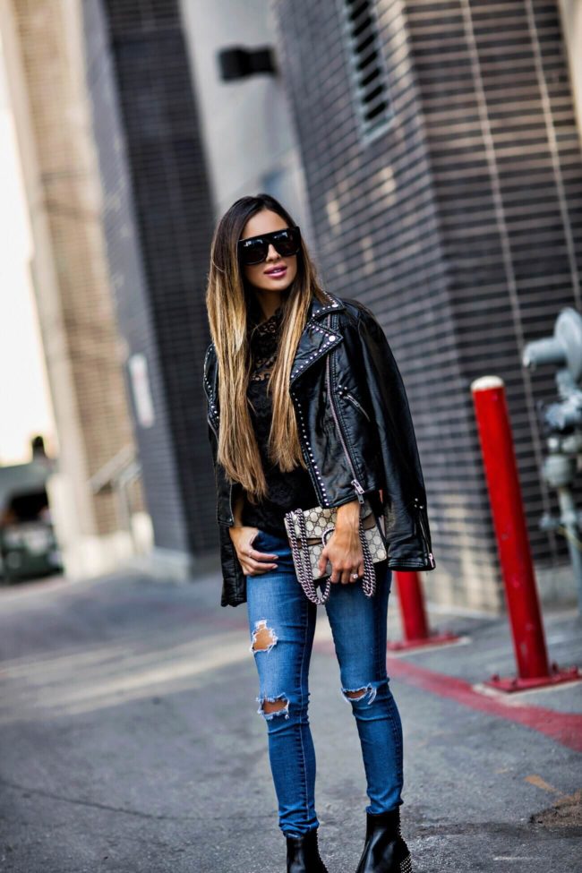 fashion blogger mia mia mine wearing black sunglasses from bloomingdale's and a studded faux leather jacket
