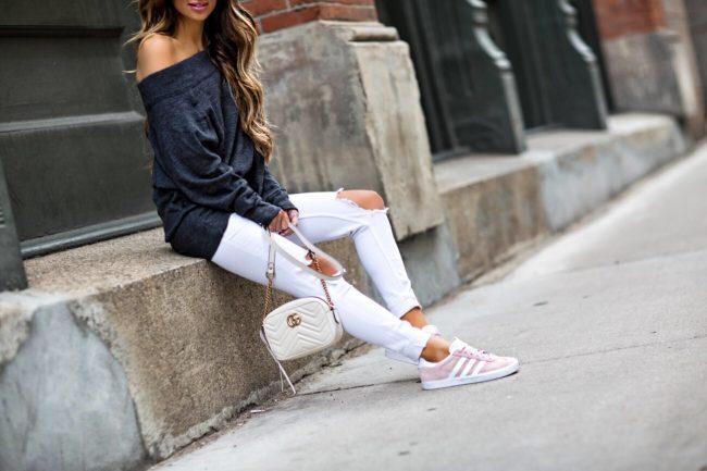 fashion blogger mia mia mine wearing a free people off the shoulder sweater from macy's and adidas sneakers