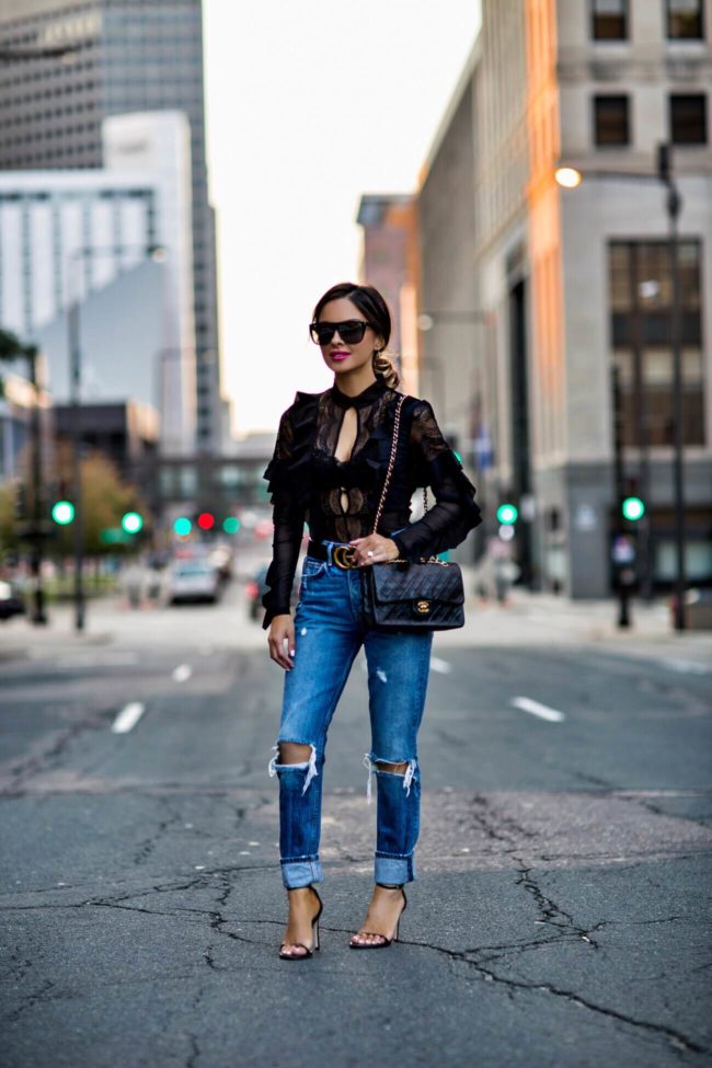 minnesota fashion blogger wearing ripped jeans and a bodysuit