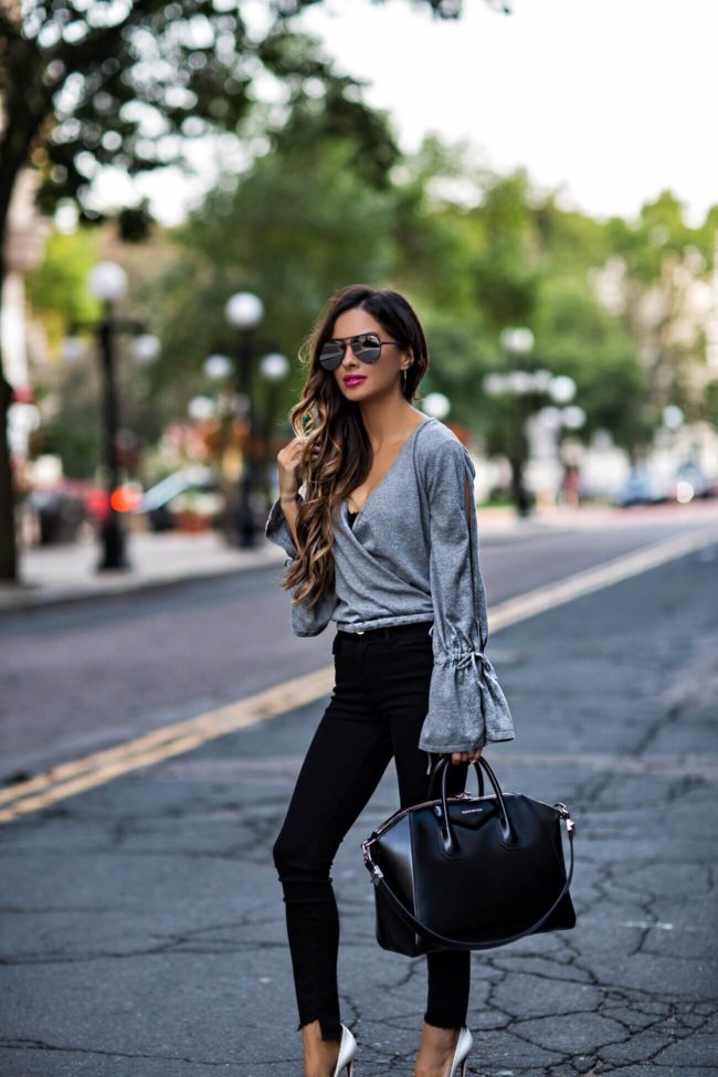 Fashion blogger Mia Mia Mine with long brown hair in loose curls