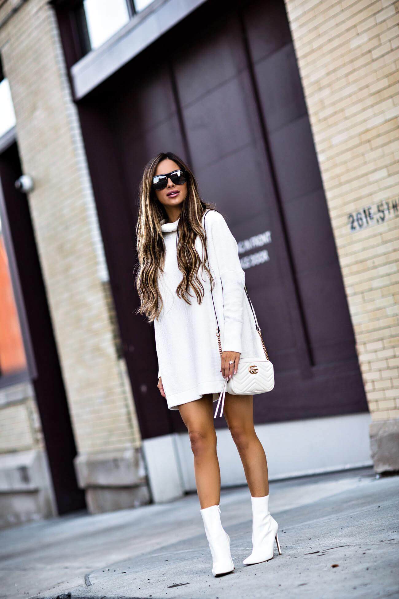 fashion blogger mia mia mine wearing a white free people sweater dress and white steve madden booties from macy's