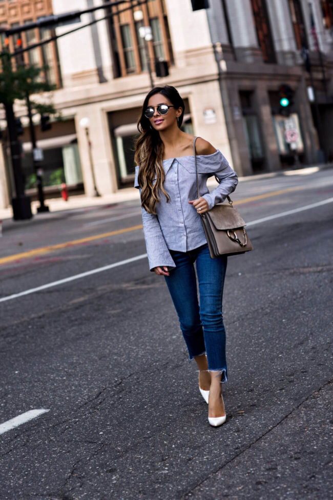 fashion blogger mia mia mine wearing a striped top from revolve and rag & bone jeans