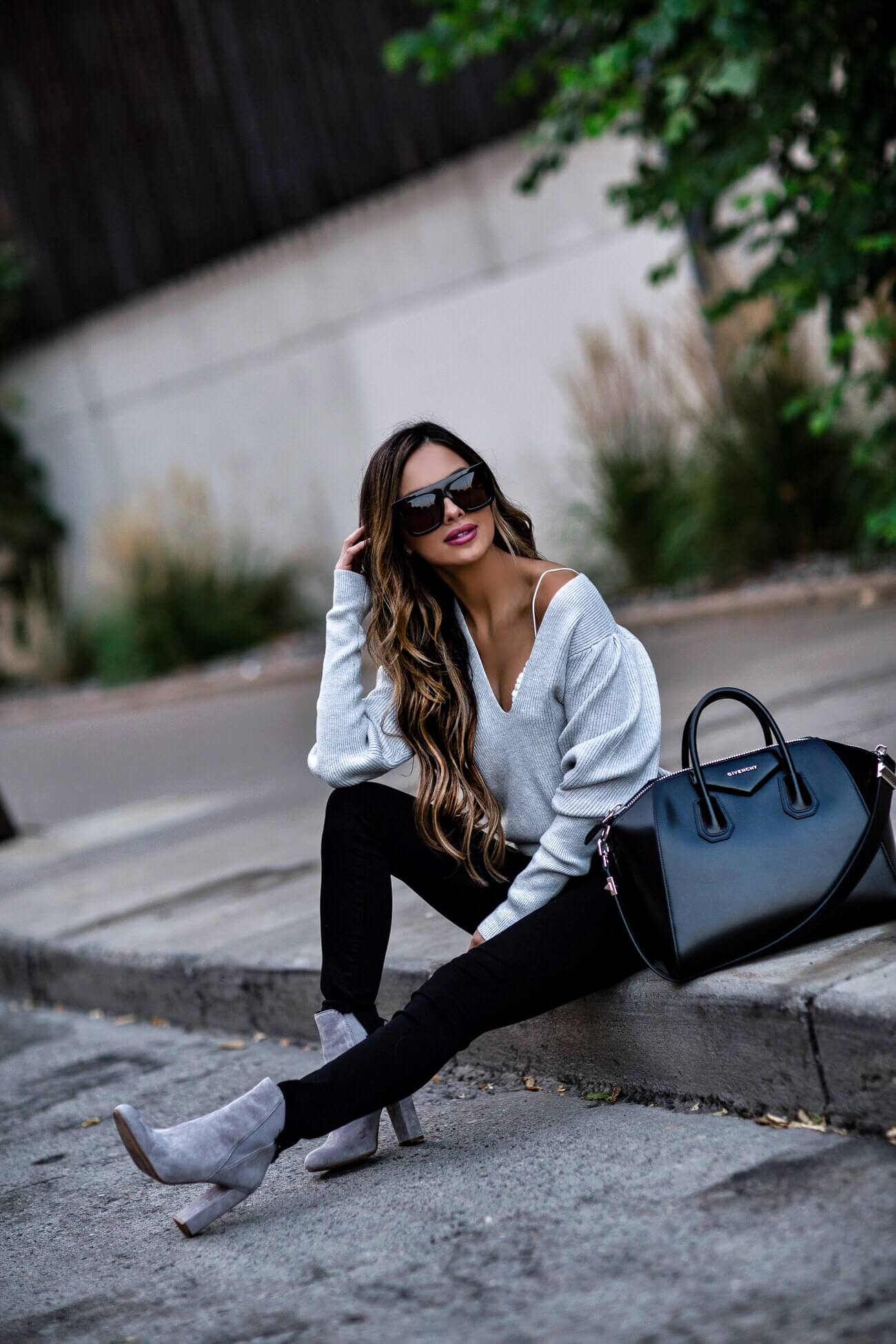 fashion blogger mia mia mine wearing a gray free people sweater and gray booties by steve madden