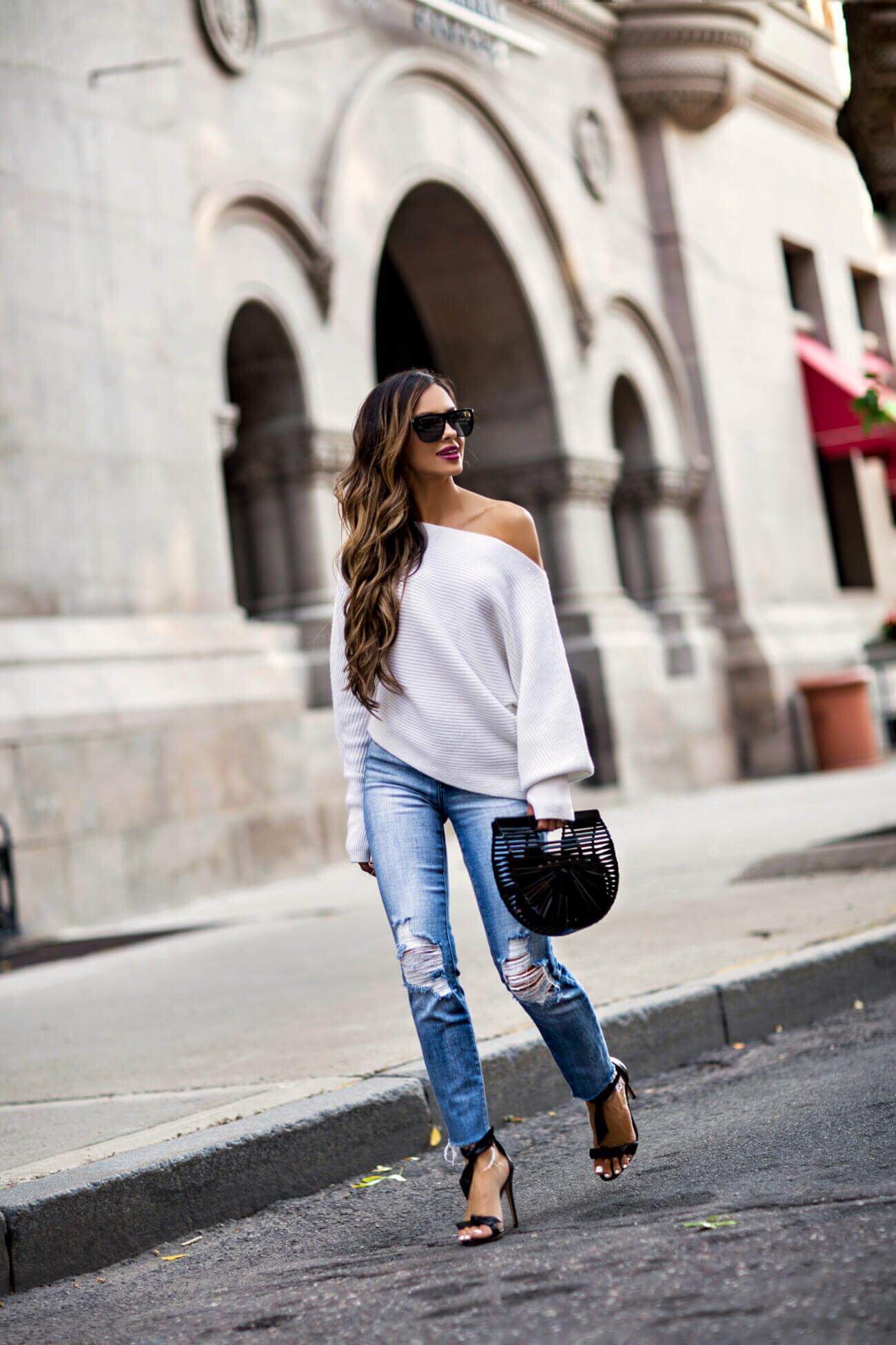 fashion blogger mia mia mine wearing a white off-the-shoulder sweater from intermix and a cult gaia handbag