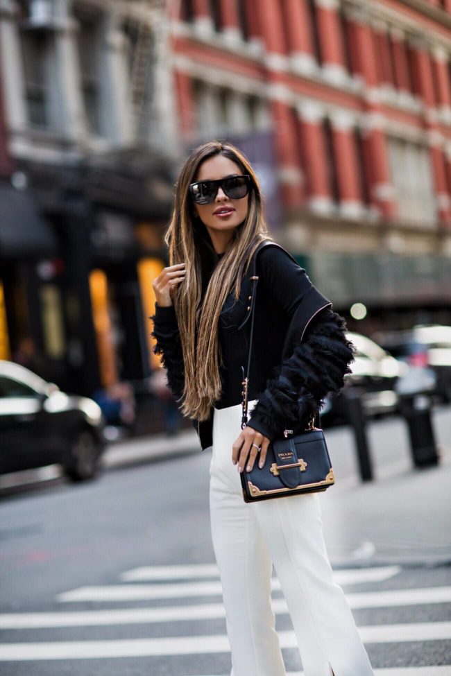 fashion blogger mia mia mine wearing a prada cahier bag at nyfw 2017