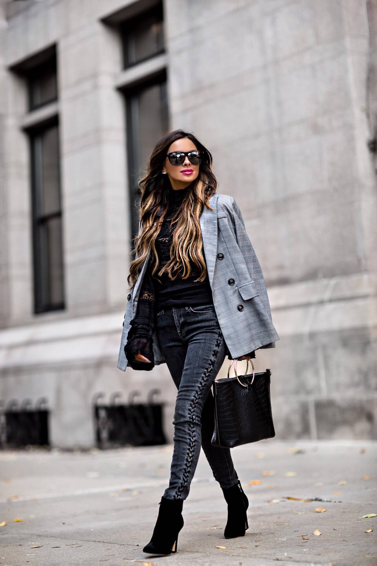 fashion blogger mia mia mine wearing a plaid blazer and black velvet booties from bloomingdale's