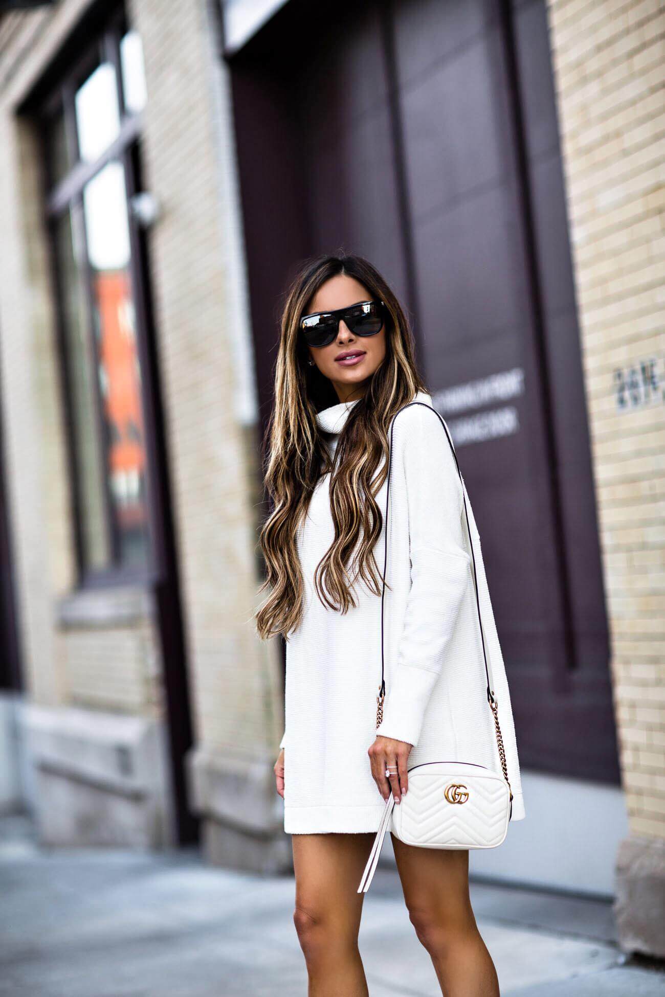 fashion blogger mia mia mine wearing a white free people sweater dress from macy's