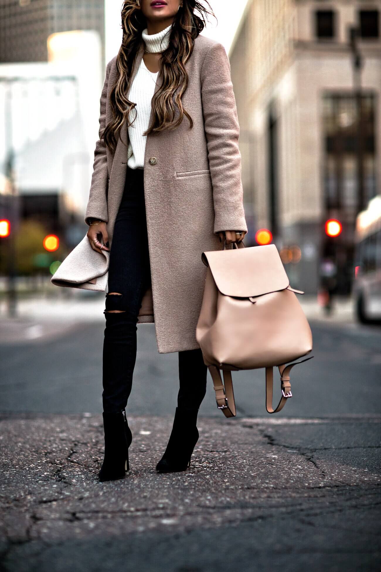 fashion blogger mia mia mine wearing a camel backpack from bloomingdale's