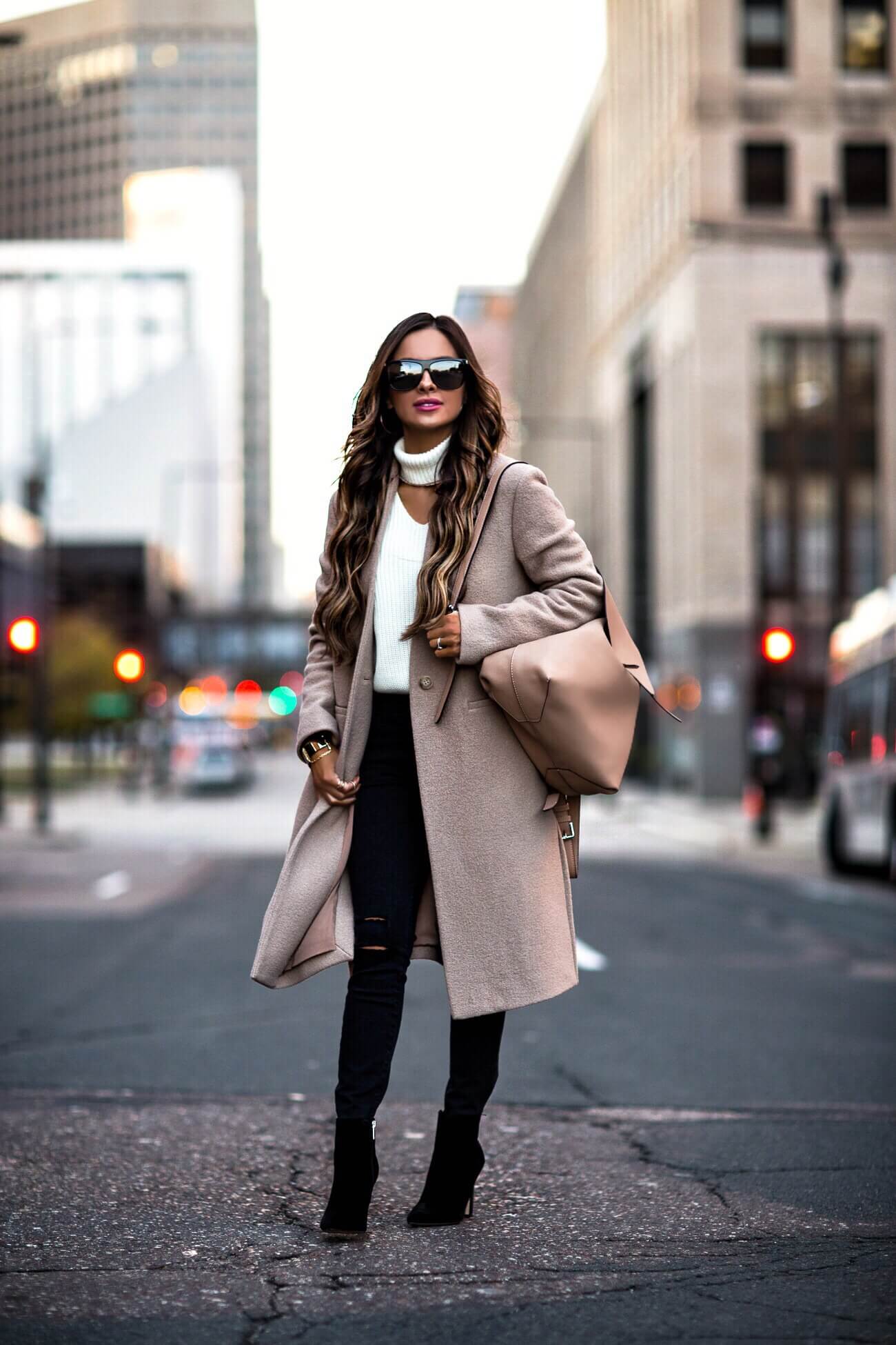 fashion blogger mia mia mine wearing a camel coat and black jeans from bloomingdale's