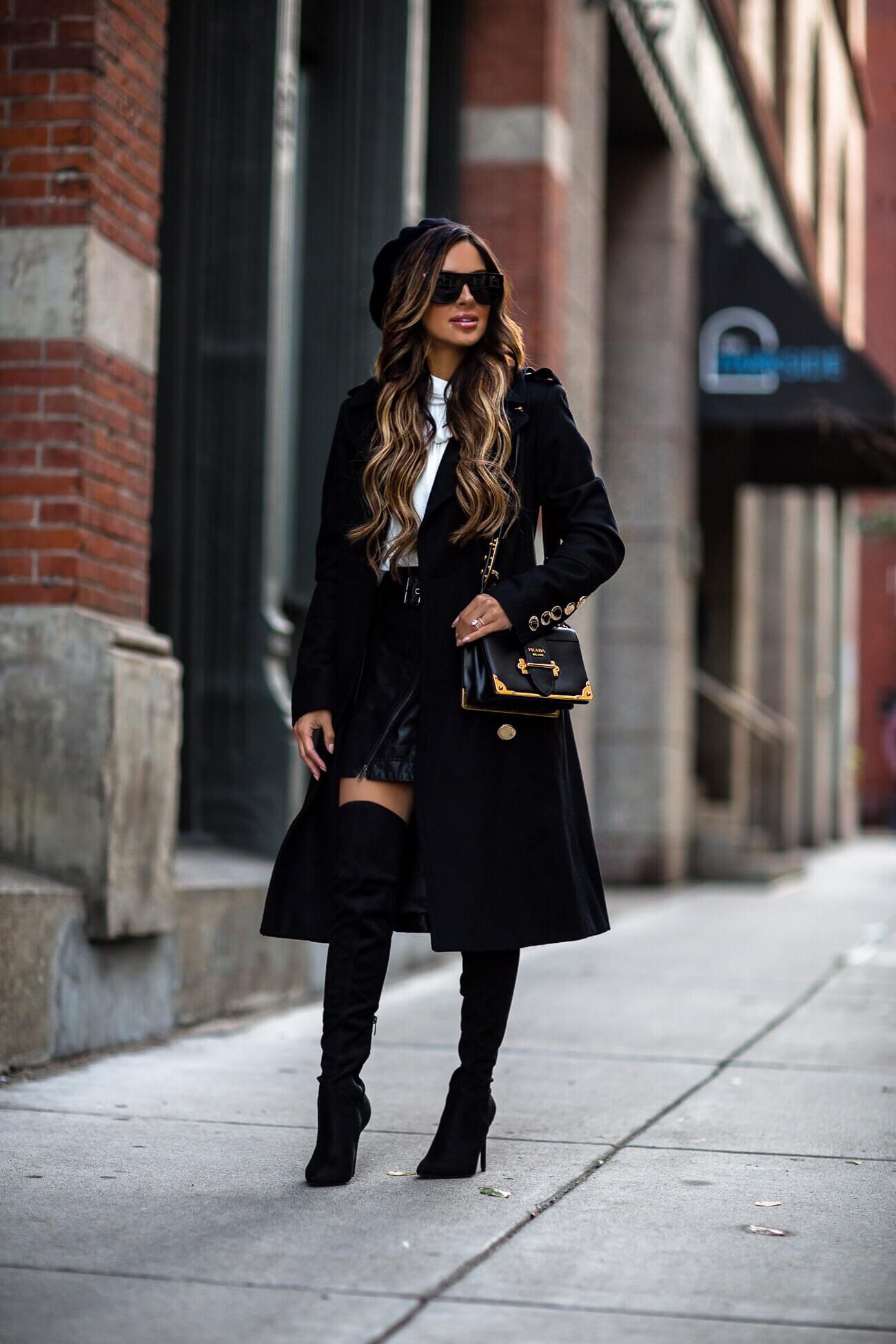 fashion blogger mia mia mine wearing a calvin klein coat from macy's and a prada cahier bag