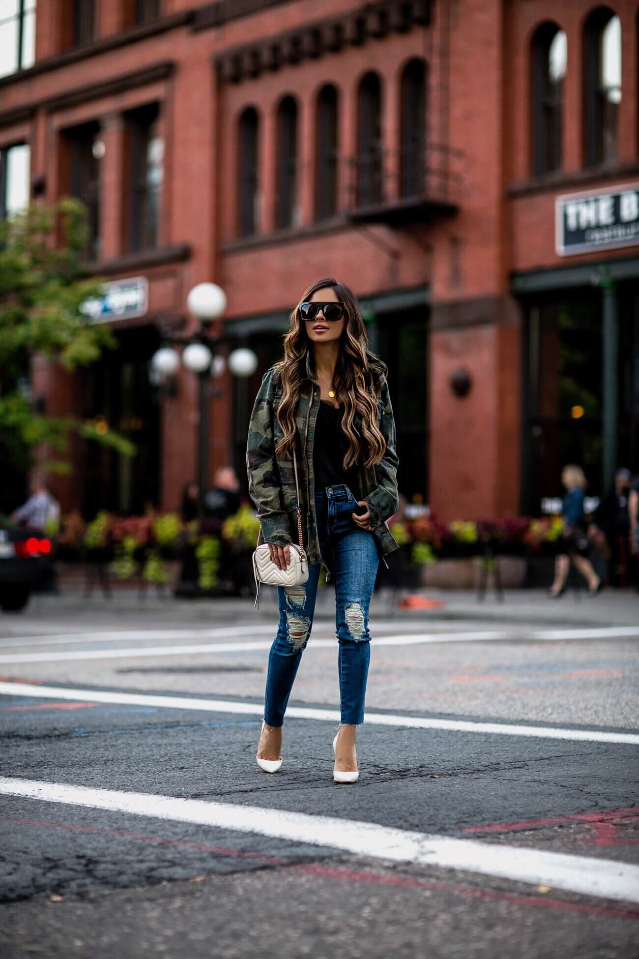 fashion blogger mia mia mine wearing a camo jacket from shopbop