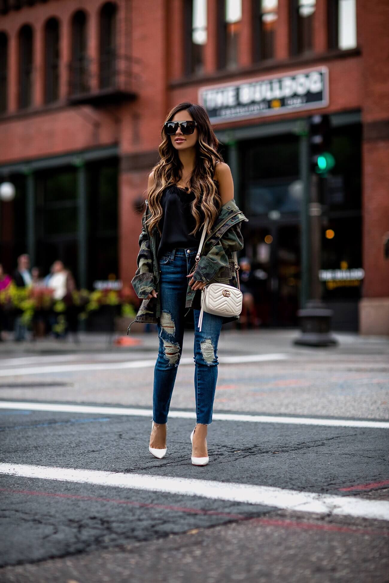 fashion blogger mia mia mine wearing a camo jacket from shopbop and distressed denim by l'agence