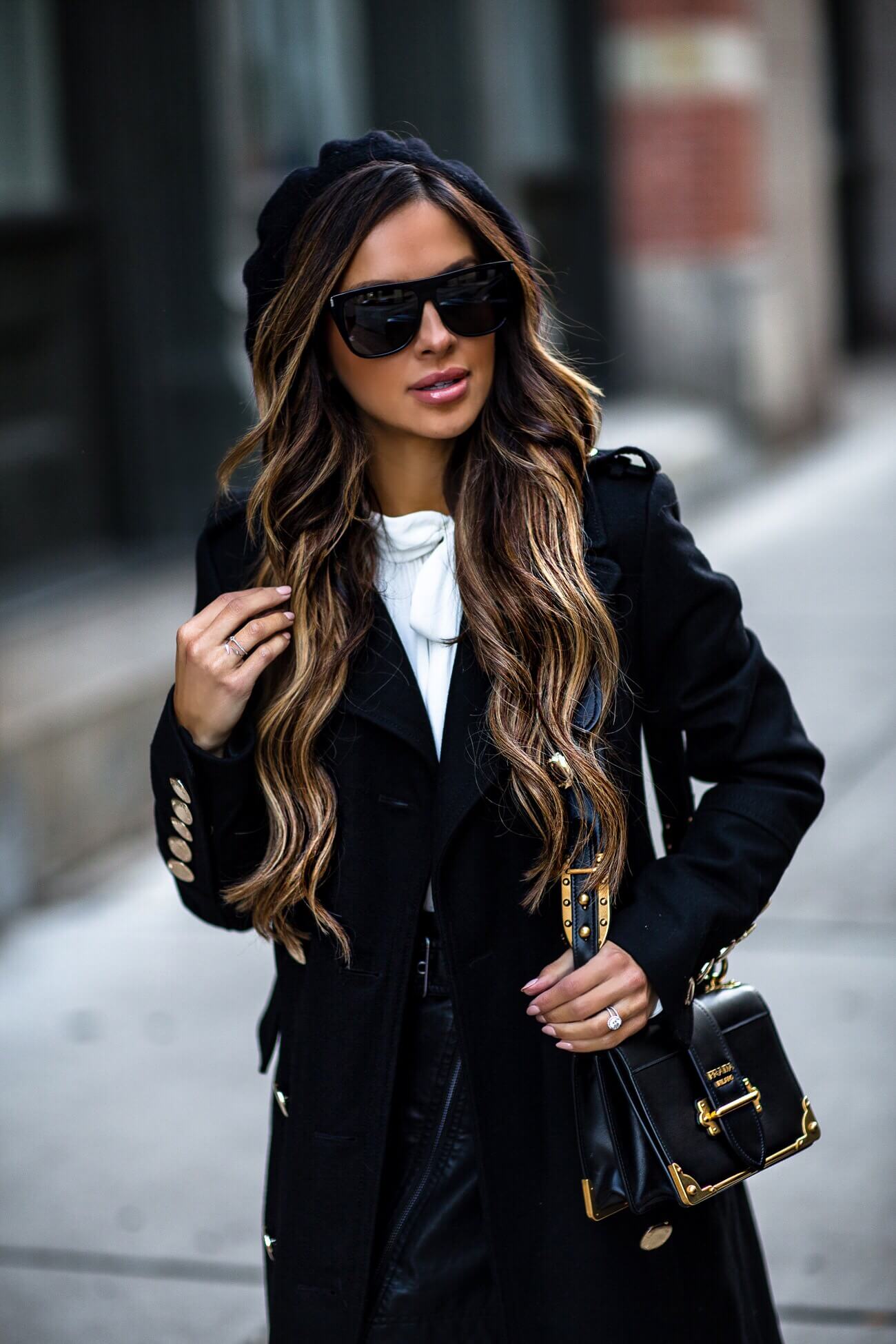 fashion blogger mia mia mine wearing a prada cahier bag and saint laurent sunglasses