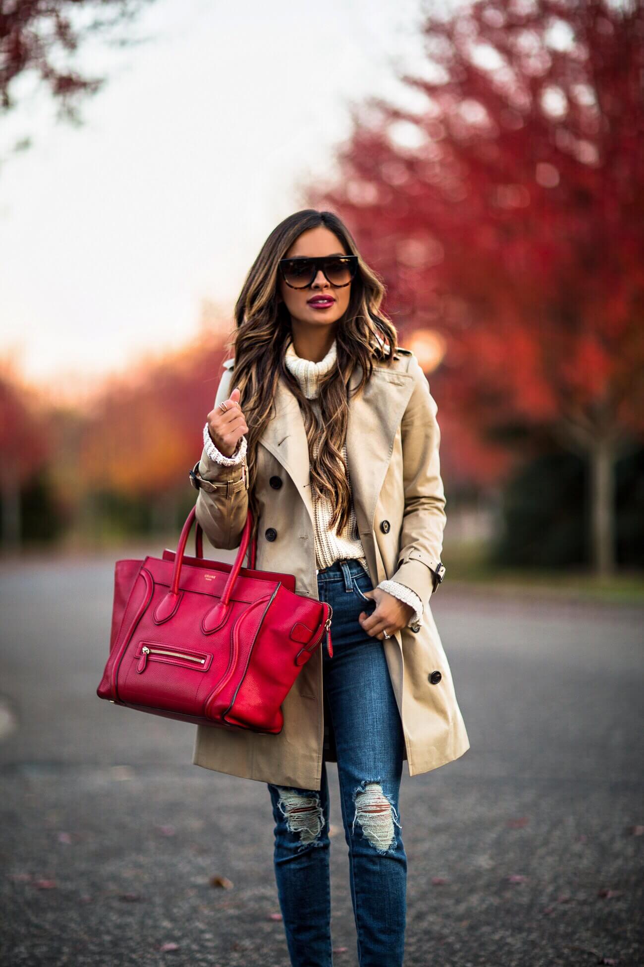 fashion blogger mia mia mine wearing a red celine tote and a burberry trench coat
