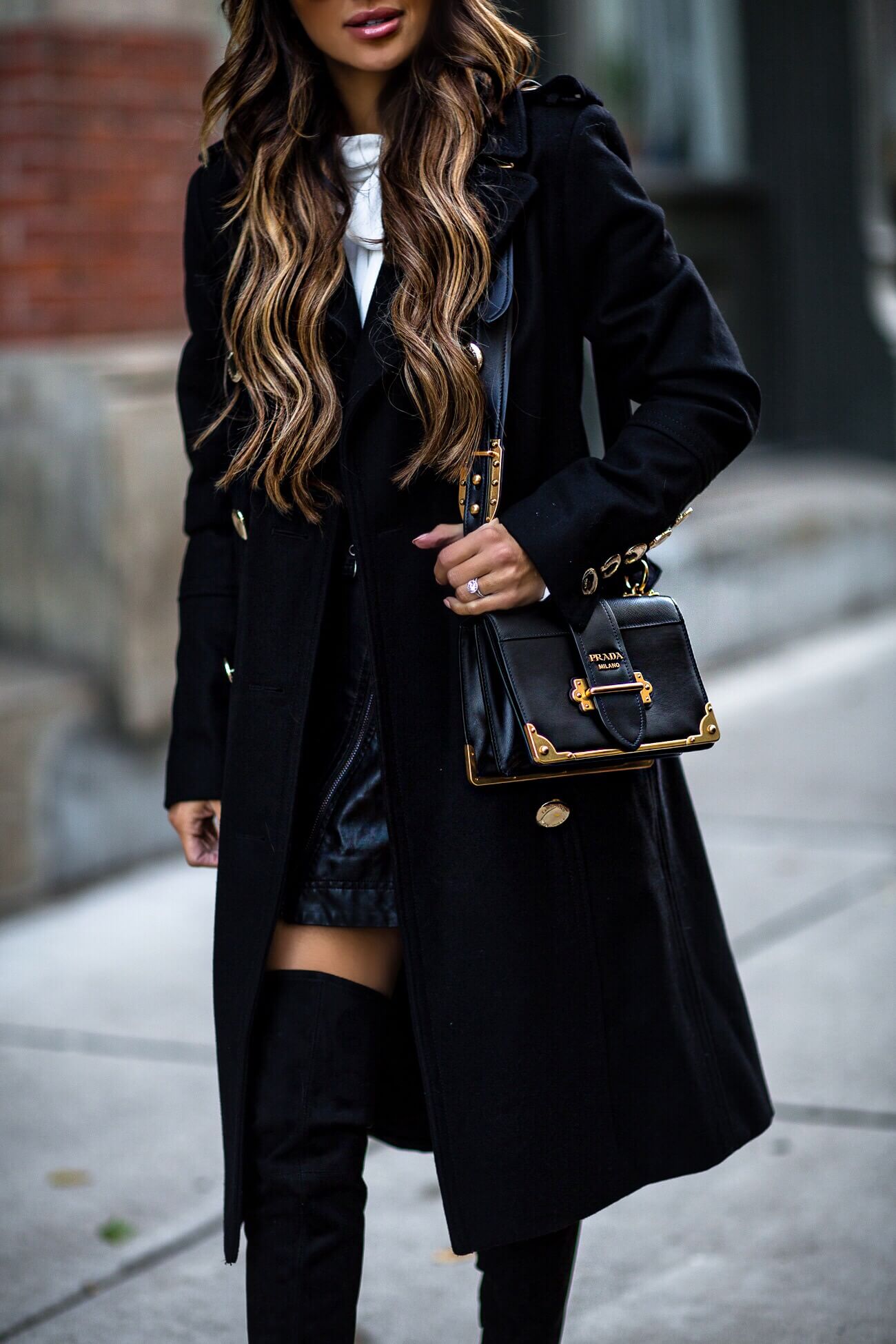 mia mia mine wearing a prada cahier bag