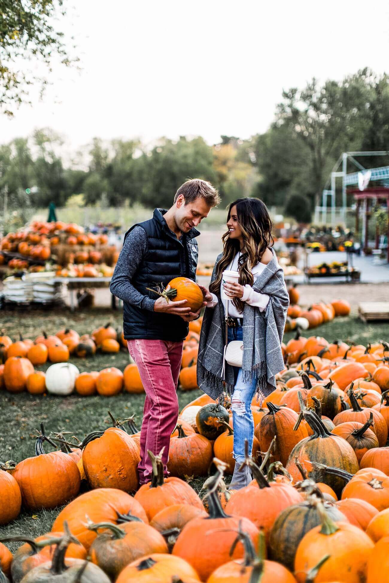 fashion blogger mia mia mine with husband phil at a pumpkin patch
