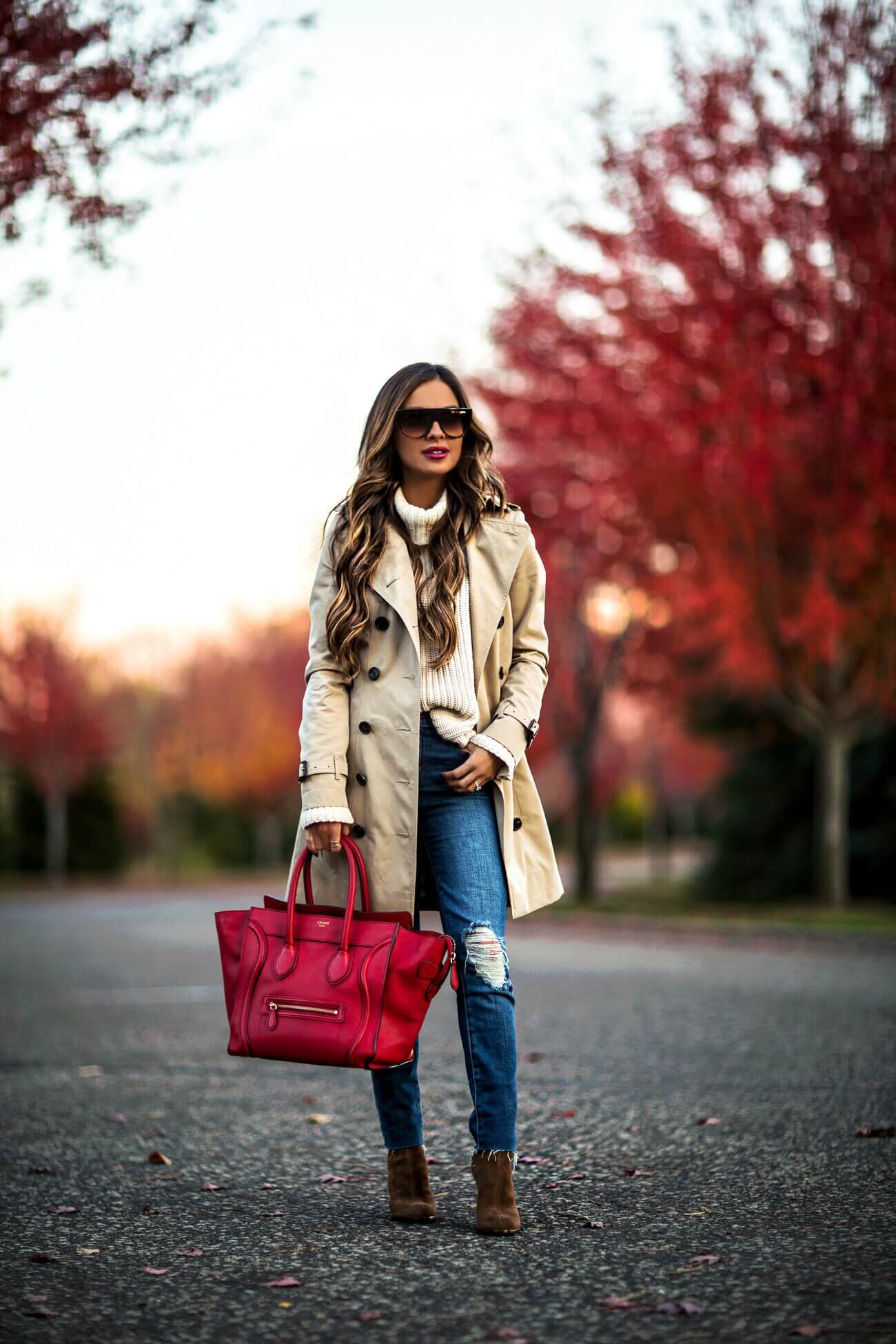 fashion blogger mia mia mine wearing a burberry trench coat and a celine bag