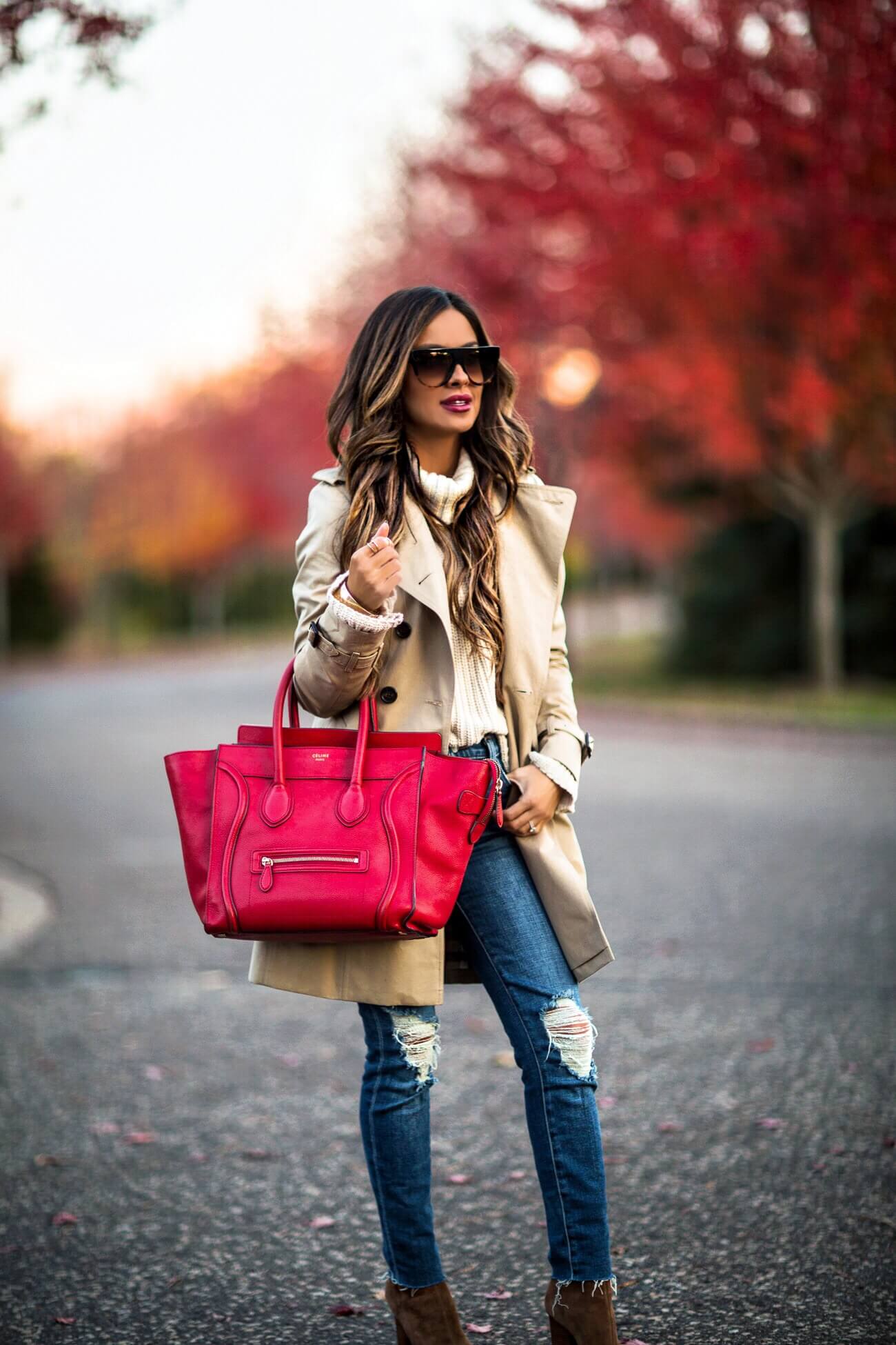 fashion blogger mia mia mine wearing a burberry jacket and a celine bag