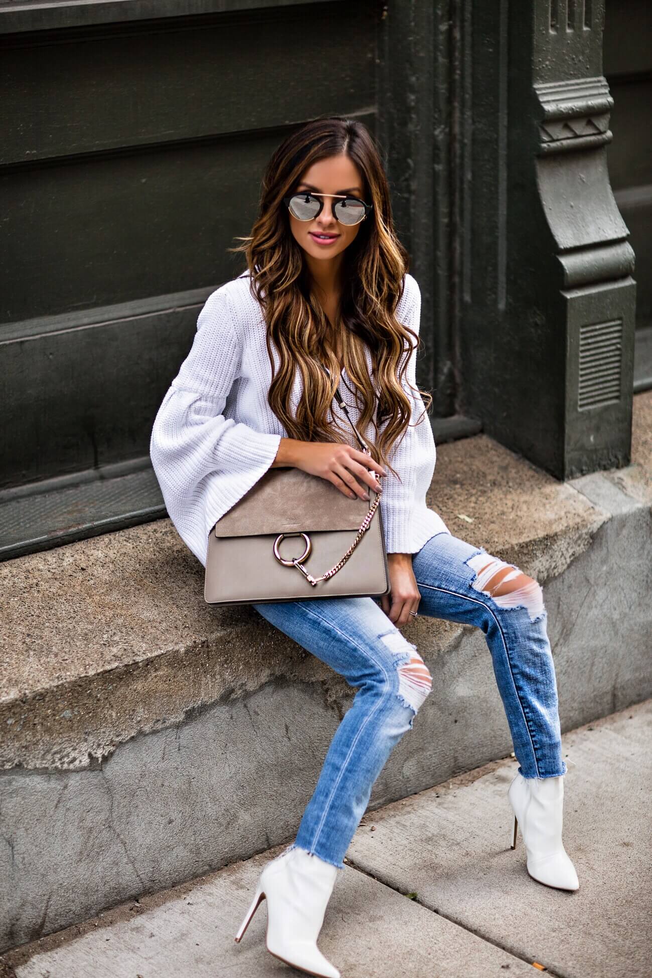 fashion blogger mia mia mine wearing a white booties from macy's and a free people sweater