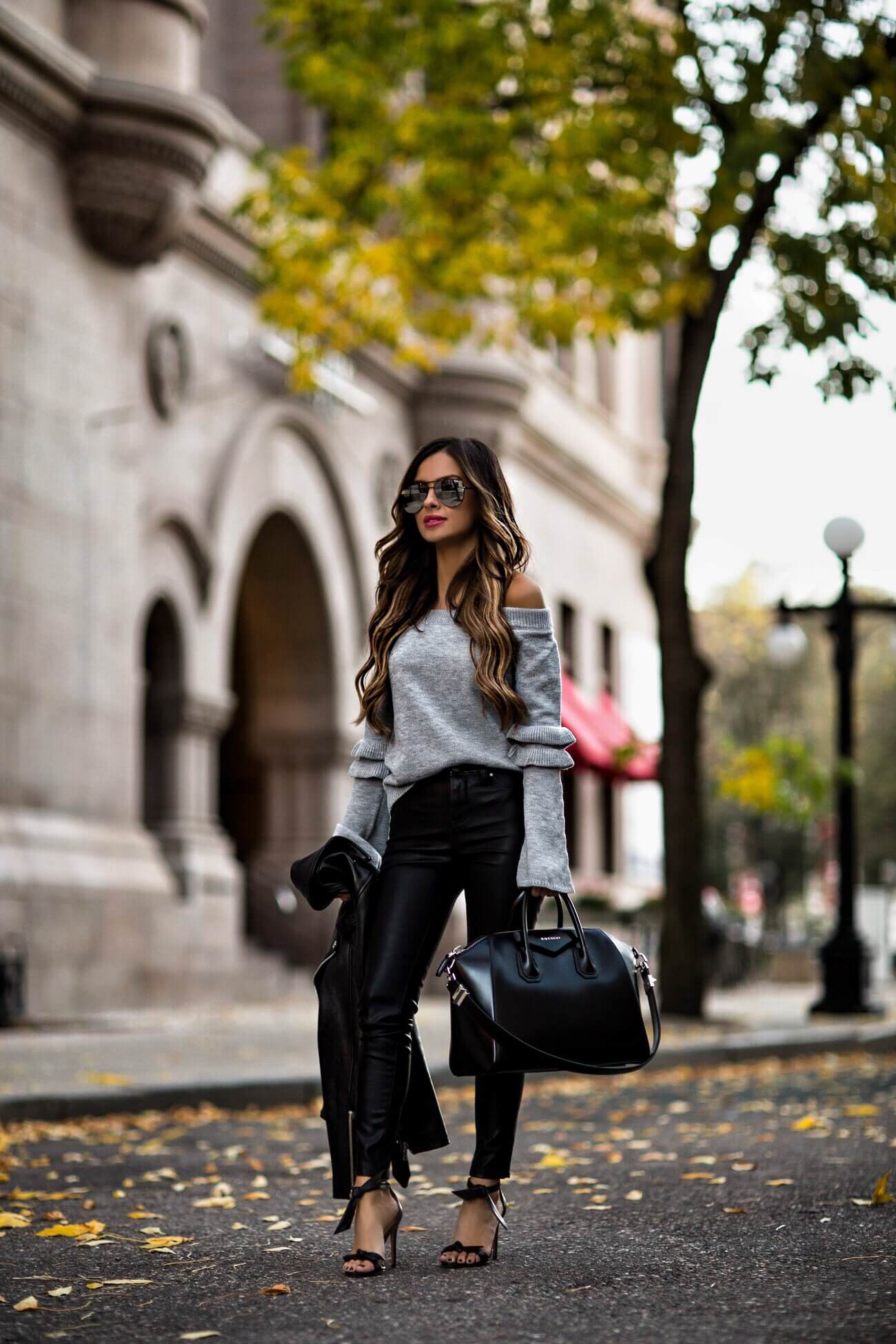 fashion blogger mia mia mine wearing a gray off shoulder sweater from shopbop and leather pants from blanknyc