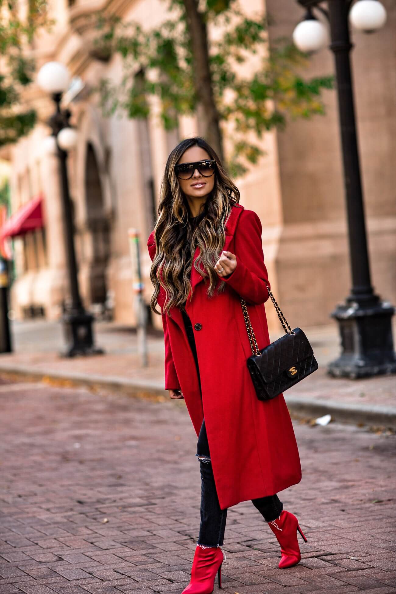 fashion blogger mia mia mine wearing a red coat by kendall + kylie and a chanel bag