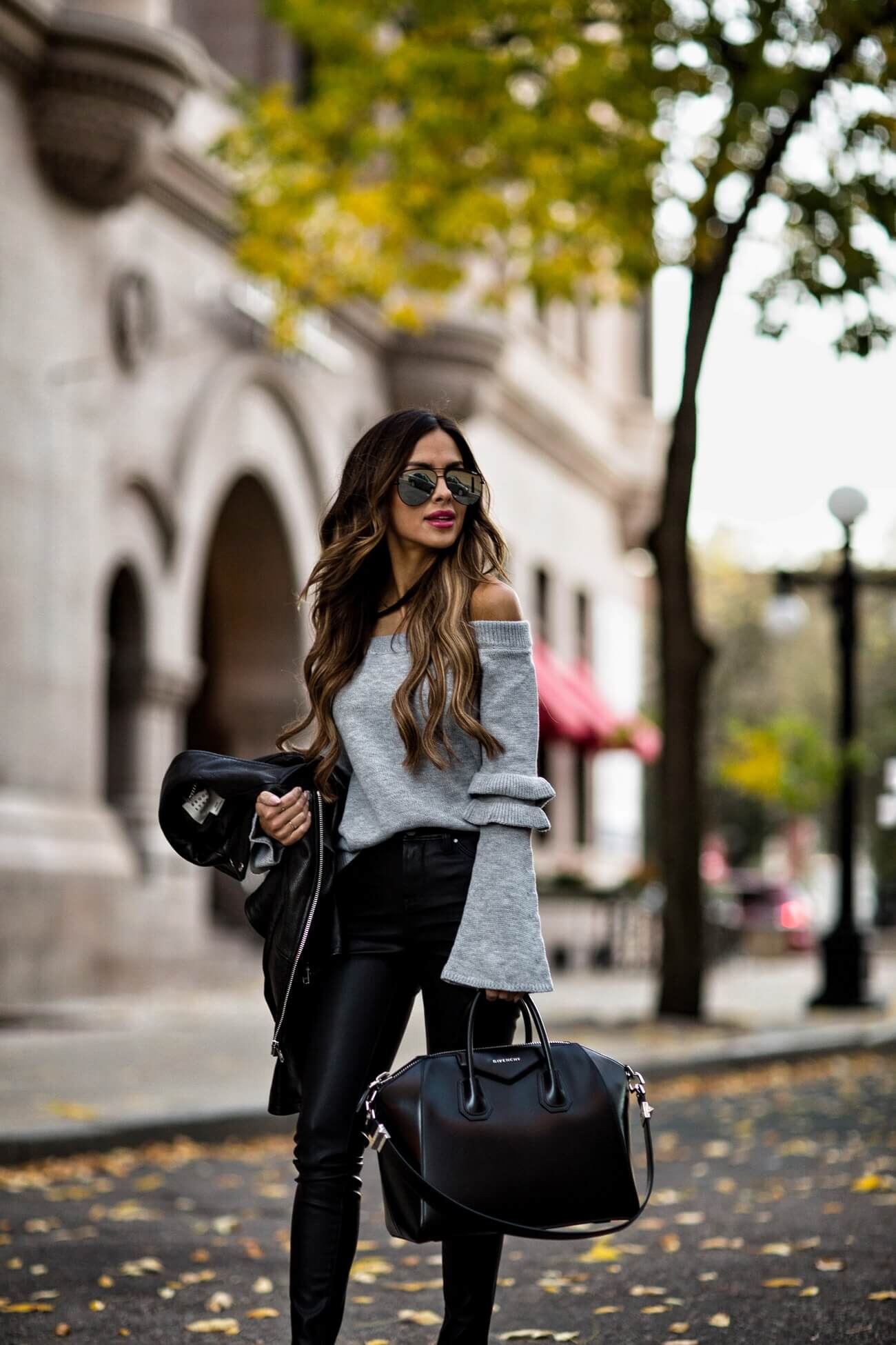 fashion blogger mia mia mine wearing a gray off-the-shoulder sweater and blanknyc leather pants from shopbop
