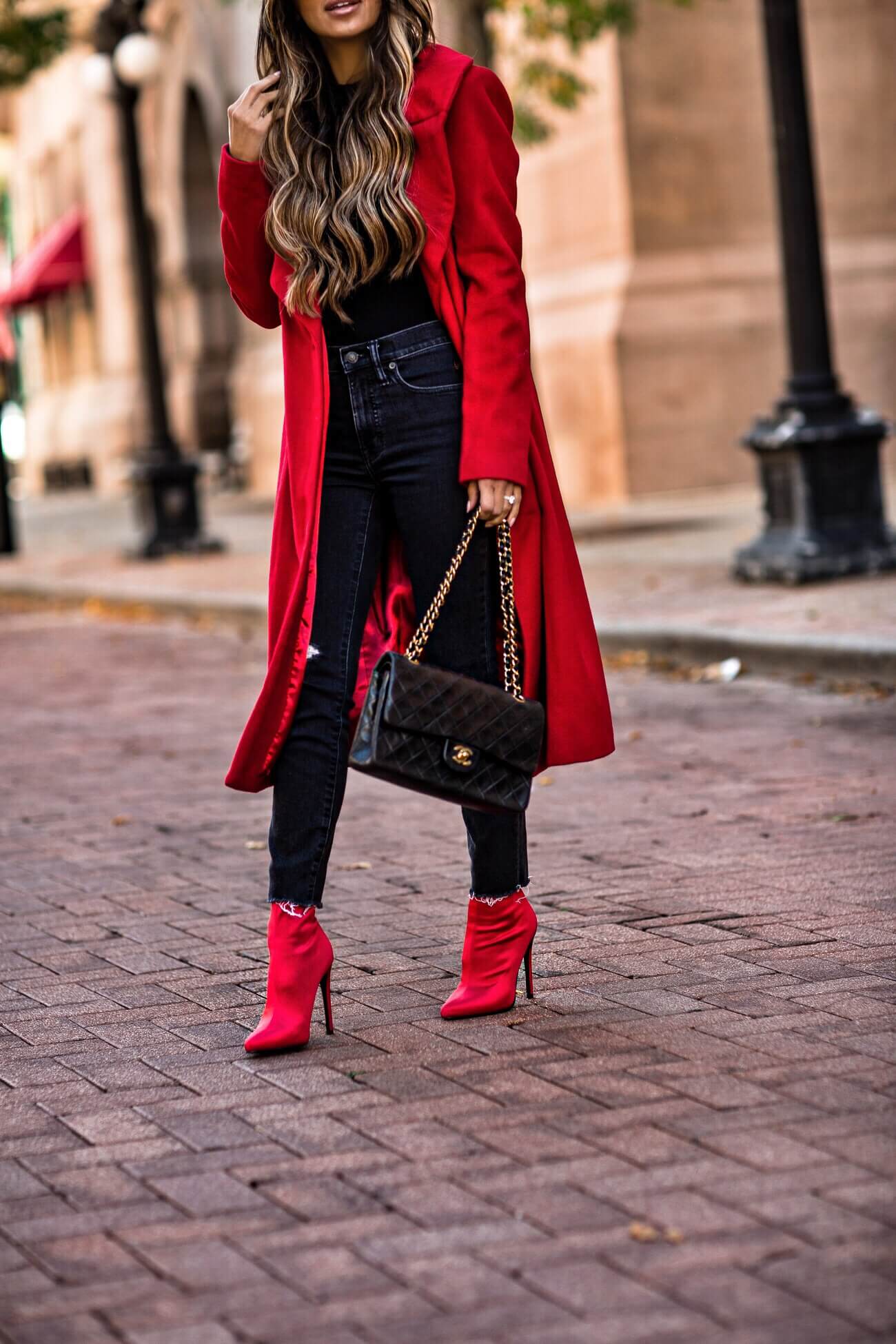 fashion blogger mia mia mine wearing a red coat from bloomingdale's