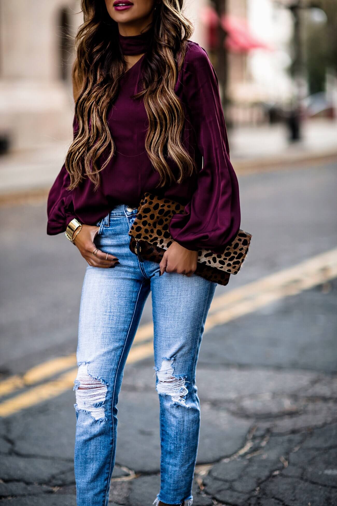 fashion blogger mia mia wearing a leopard clutch from intermix and a purple top