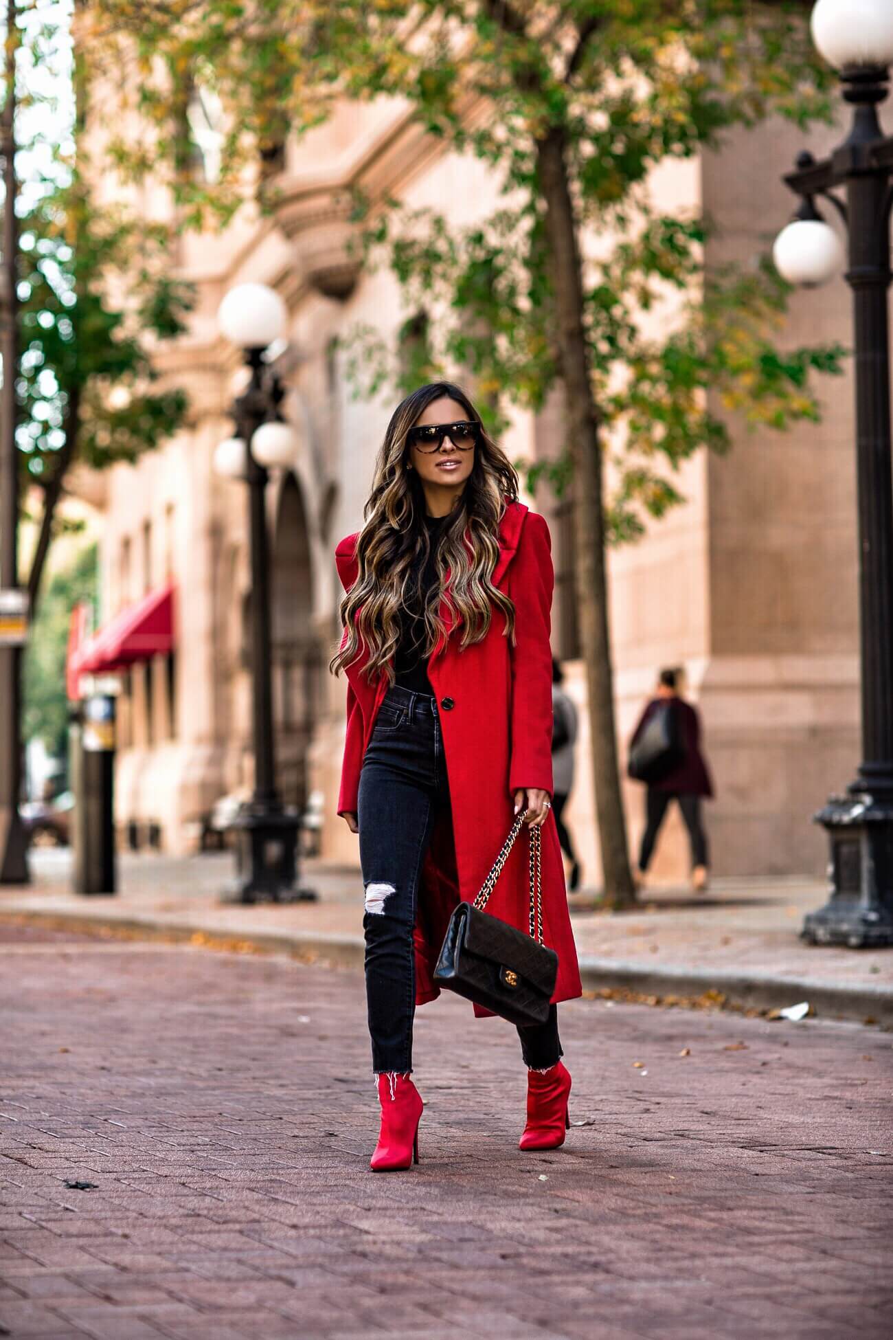 mia mia mine wearing red booties and a red coat from bloomingdale's