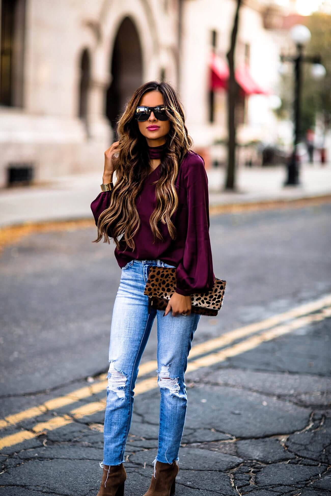 fashion blogger mia mia mine wearing celine sunglasses and a clare v leopard bag