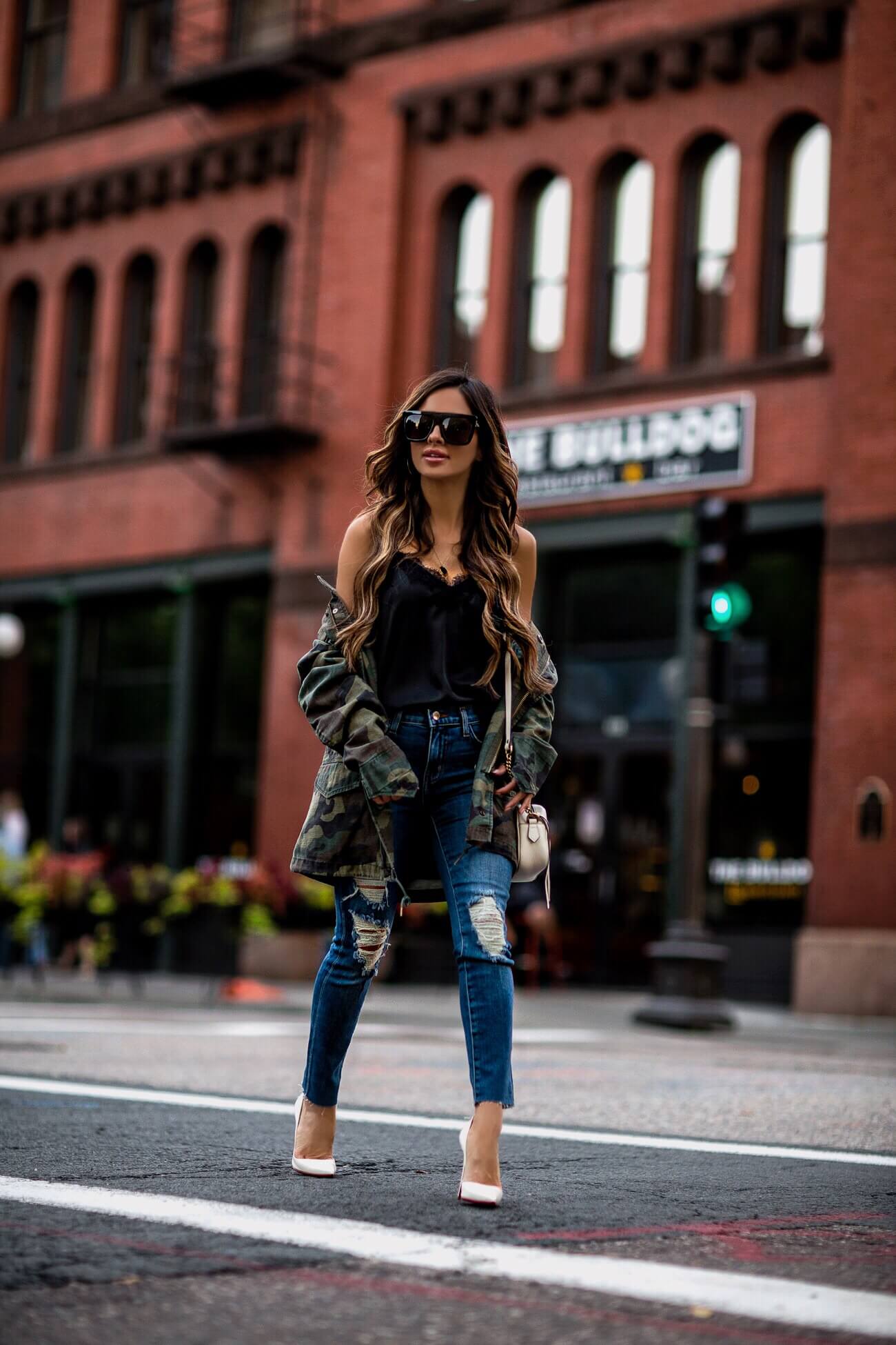 mia mia mine wearing l'agence distressed denim and a camo jacket from shopbop
