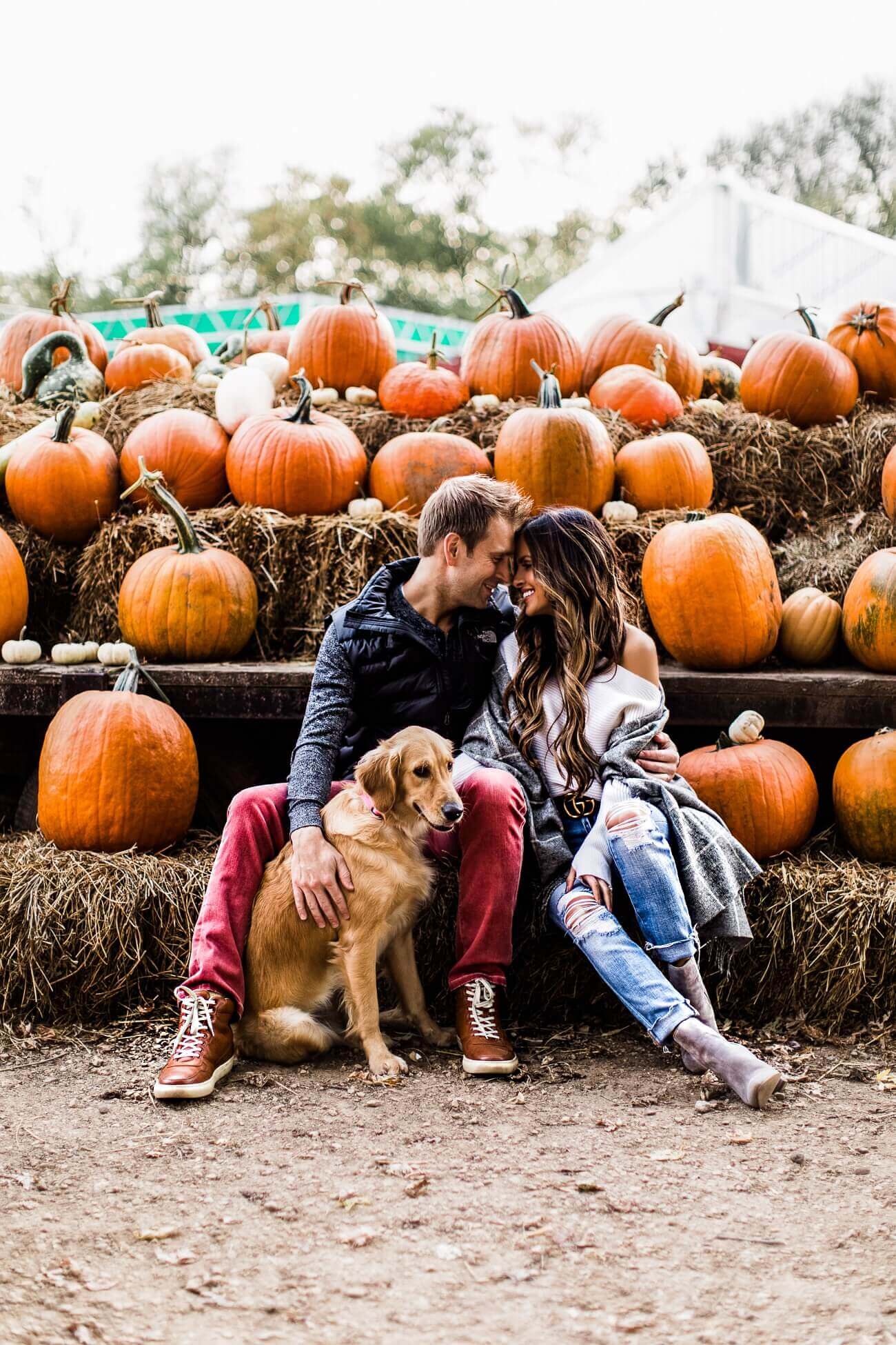 fashion blogger mia mia mine with husband at a pumpkin patch