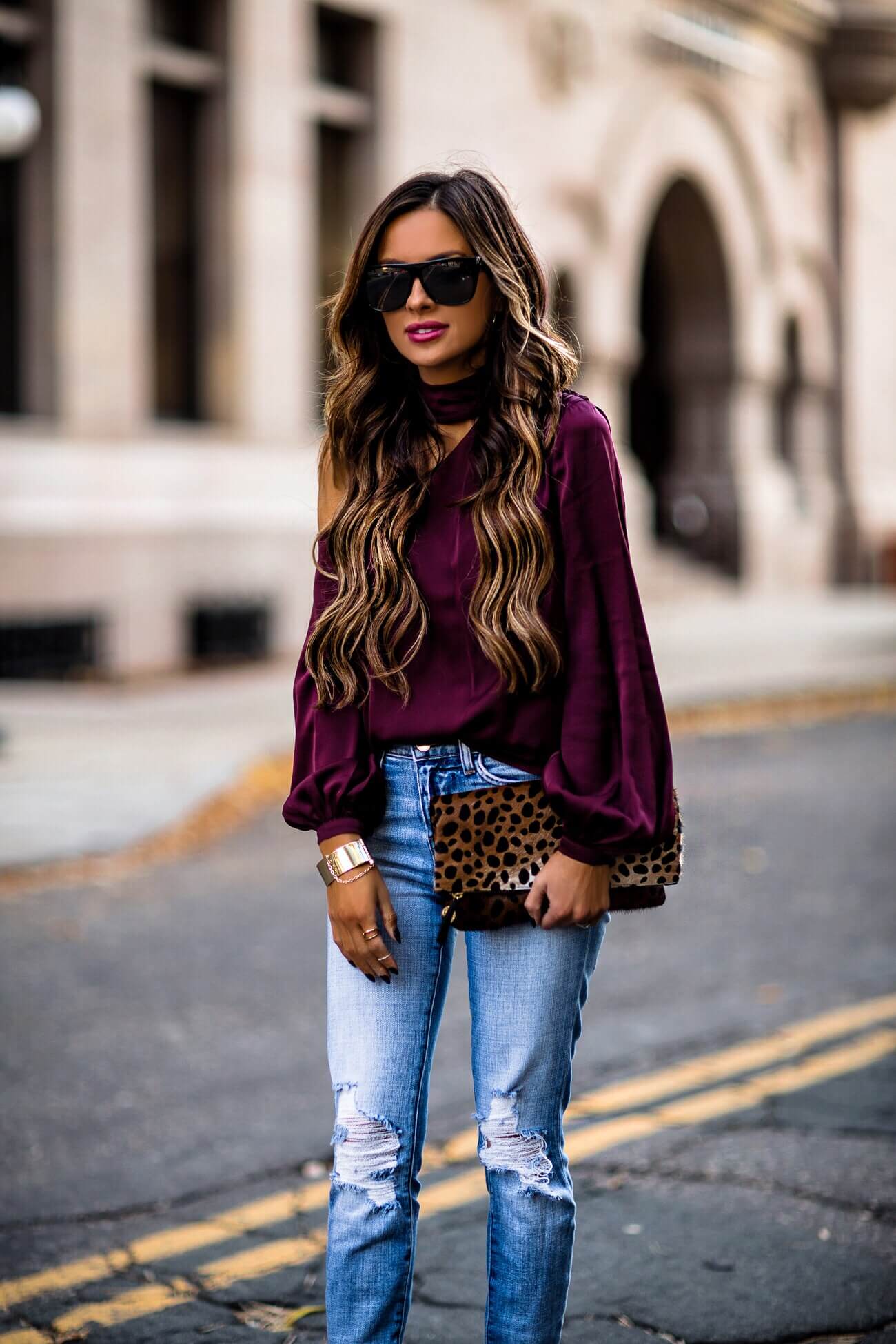 fashion blogger mia mia mine wearing a purple top from intermix