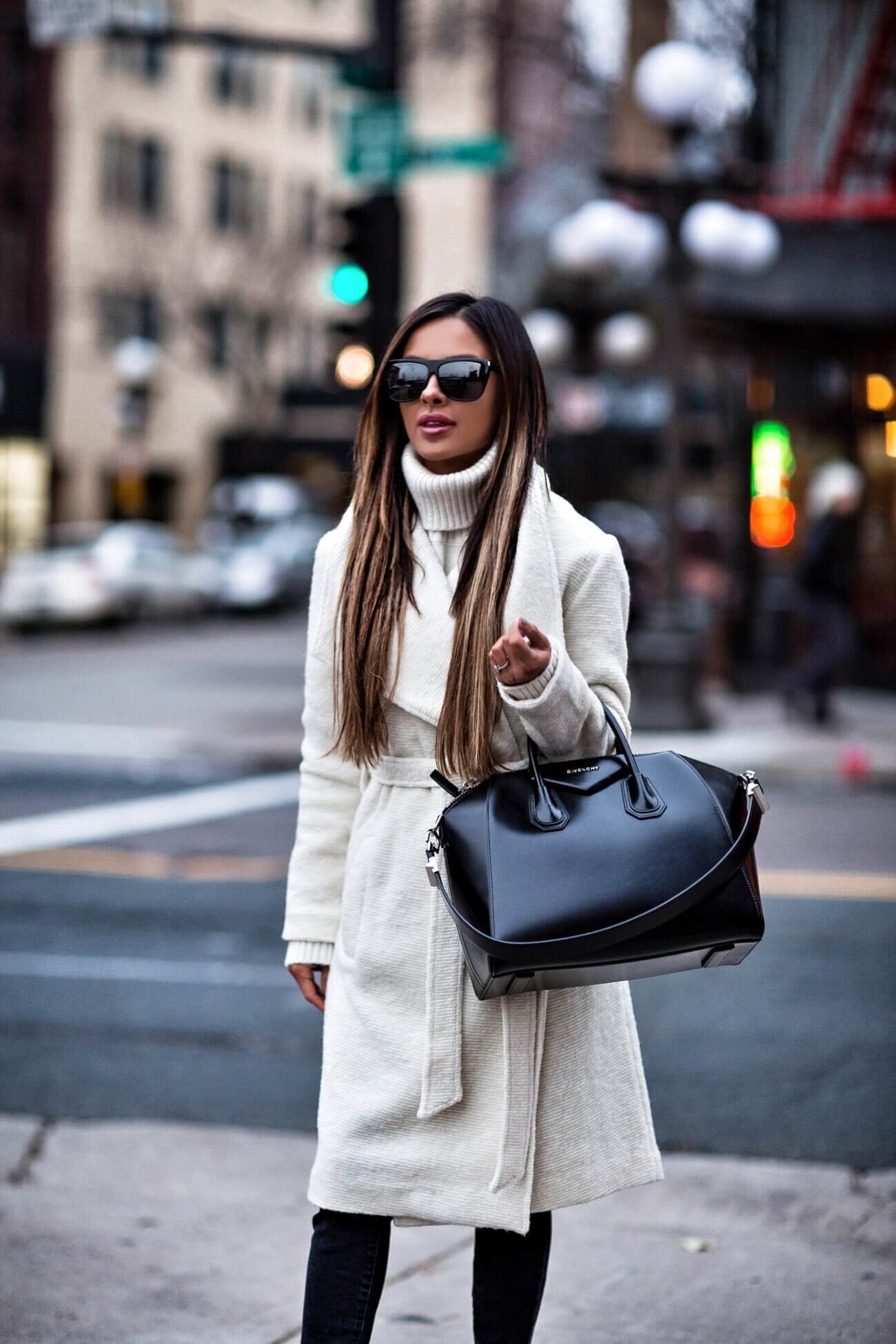 fashion blogger mia mia mine wearing a white wrap coat from shopbop and a givenchy antigona bag