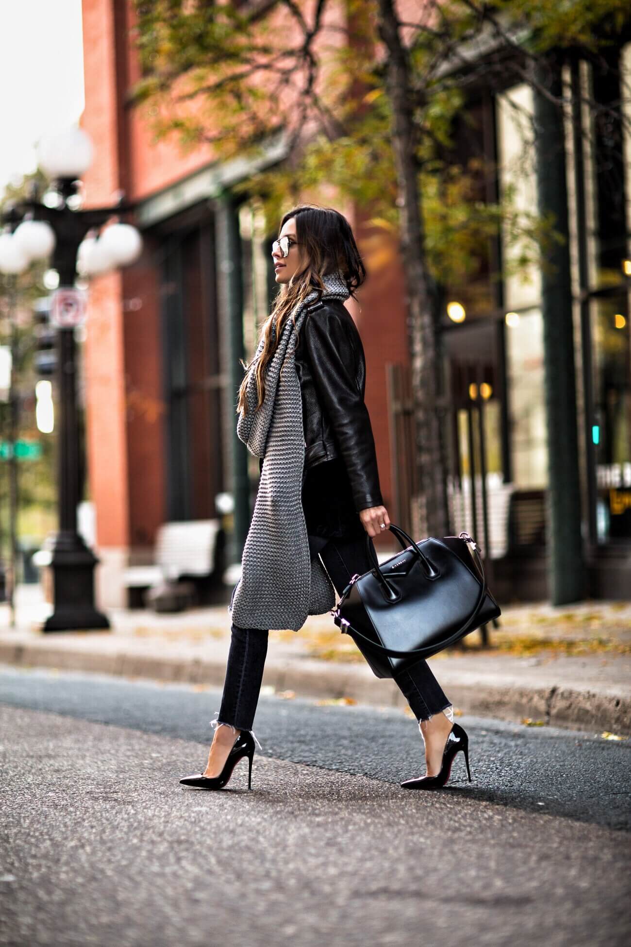 fashion blogger mia mia mine wearing a christian louboutin heels and a givenchy antigona bag